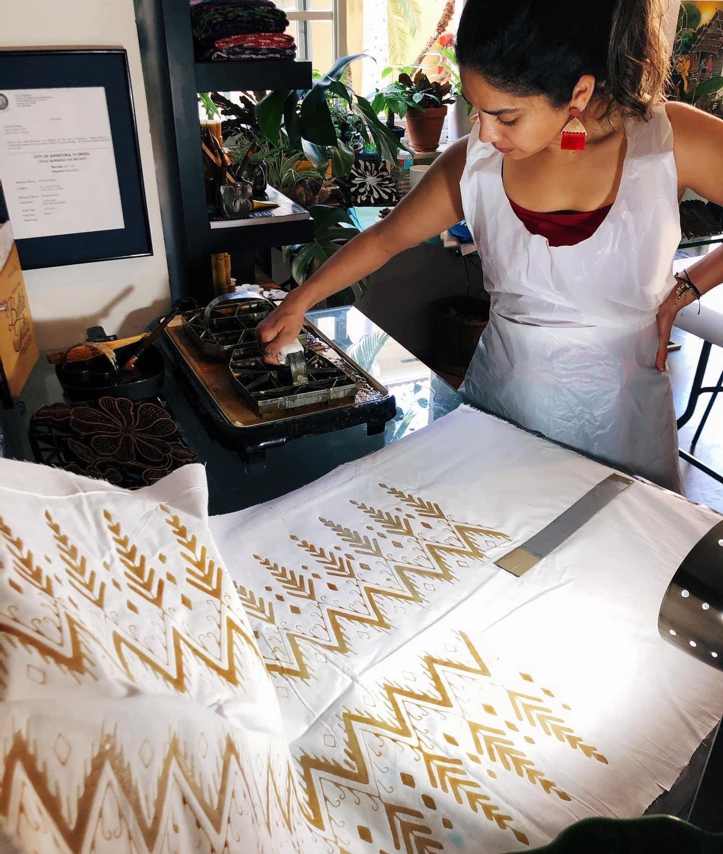 Create wearable hand-stamped batik fabric in my home studio